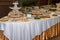 Buffet table with mini hamburgers, snacks, canape and appetizers at luxury wedding reception, copy space. Serving food.