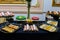 A buffet of various salted macarons, sushi and oriental sweets