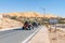 Buggy cars riding on the road to the big sand dune of Taghit.