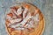 Bugnes, French donuts in transparent plate on wooden board