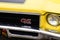 Buick Riviera GS yellow car with brand text and sign logo on muscle car race retro