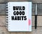 Build good habits symbol. Words written in the office notebook