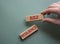 Build resilience symbol. Wooden blocks with words Build resilience. Beautiful grey green background. Businessman hand. Business