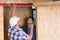 Builder and Architect Inspecting Door Frame