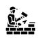 builder building with brick glyph icon vector illustration