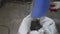 Builder cleaning room from old concrete and bricks after demolition jobs. A worker removes garbage with a dustpan