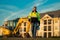 Builder, construction worker in helmet at construction site. Industry engineer worker in hardhat near bulldozer or