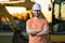 Builder, construction worker in helmet at construction site. Industry engineer worker in hardhat near bulldozer or