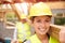 Builder And Female Apprentice Carrying Wood On Site