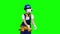 Builder girl in virtual reality glasses plays an interesting game. Green screen