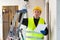 Builder handyman examining room and planning construction works