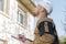 Builder in hardhat with clipboard outdoors