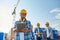 Builder in hardhat with tablet pc at construction