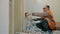 A builder plumber lays water pipes in a bathroom during renovations in a house.