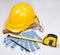 Builder\'s tools - yellow helmet, work gloves, hammer, pen and me