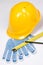 Builder\'s tools - yellow helmet, work gloves, pen and measure ta