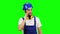 Builder speaks on the phone with his boss. Green screen