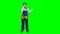 Builder is standing and talking on the phone with a drawing in her hands. Green screen