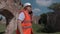 Builder talking and shows gestures in the castle yard