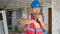 builder talking on walkie talkie at construction site