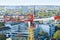 A builder on top of a tower crane above the city of Hamburg