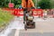 Builder using petrol powered road saw with dimond blade to cut asphalte road surface