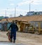 Builder worker carries a wheelbarrow