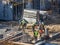 Builder workers pouring concrete