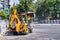 Builders repair the pavement with industrial equipment