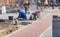 Builders repair the pavement with industrial equipment