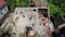 Builders walk about rubbles of cottage at demolition site