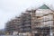 Building affordable homes with scaffolding safety by local construction council to help government social housing problem and shor