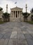 The building of the Athens Academy a marble column with a sculptures of Apollo and Athena, Socrates and Plato against a with