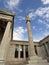 The building of the Athens Academy a marble column with a sculptures of Apollo and Athena, Socrates and Plato against a with