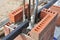 Building brick fence column with iron bar