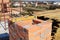 Building a chimney out of masonry, noncombustible red bricks and cement on the rooftop of a house