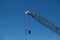Building construction crane against blue sky in Auckland, New Zealand, NZ