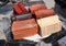 Building and construction materials, colored roof tiles organized on pallets for sale