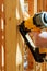 Building contractor worker putting in a interior wall partition nailer wall t