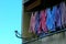 building exterior elevation and balcony detail with colorful drying cloths