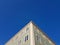 Building facade corner against blue sky