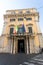 A building flies the Italian and European Union flags