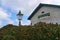 The building of former Newcastle Railway Station with antique luminous green street lantern Sea Road Leamore Upper Arklow