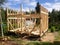 Building the frame of a wooden house. Stage of the erection of the wall frame. The House on stilts. Summer, suburban constructio