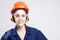 Building Ideas. Closeup of Young Caucasian Female Works Manager Posing in Hard Hat Against White