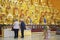 Building interior of a Buddies temple. Golden Buddha in the temple