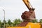 Building Machines: Digger loading trucks with soil. Excavator loading sand into a dump truck.