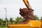 Building Machines: Digger loading trucks with soil. Excavator loading sand into a dump truck.