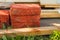 Building material for repairs in the garden-new red bricks, boards, lie on the grass