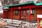 Building with painted traditional buddhist symbols red door in Tovkhon Monastery, Ovorkhangai Province, Mongolia.